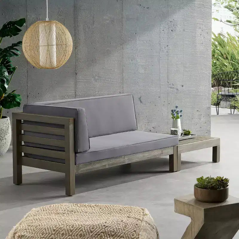 Juego de sofá biplaza con brazo izquierdo y mesa de centro para exterior de madera de acacia Christopher Knight Home Oana, con cojín