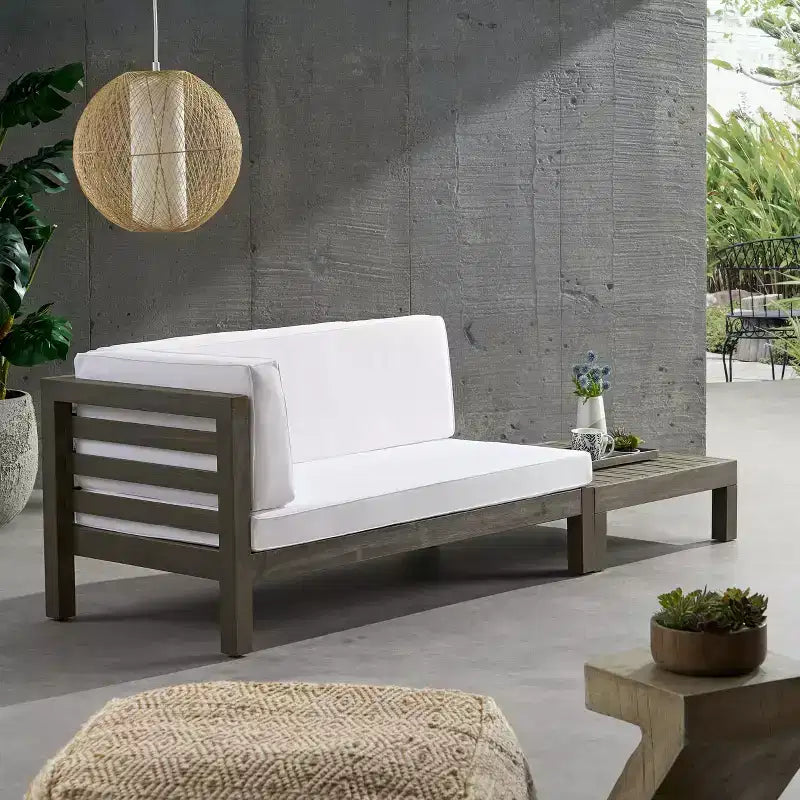Juego de sofá biplaza con brazo izquierdo y mesa de centro para exterior de madera de acacia Christopher Knight Home Oana, con cojín