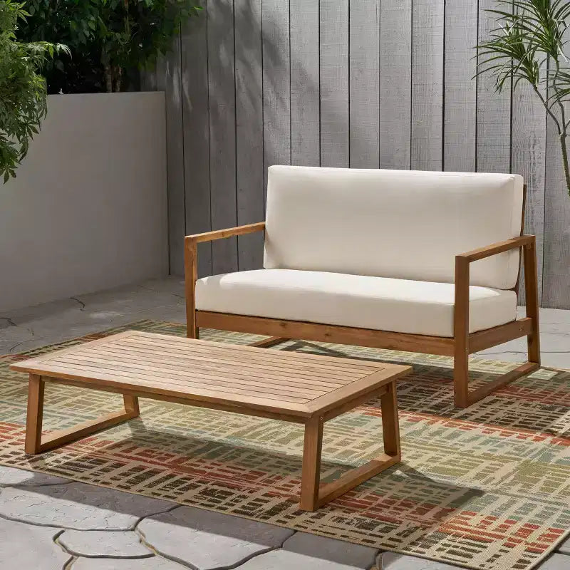 Conjunto de sofá de dos plazas y mesa de centro de madera de acacia para exterior Hazel de Christopher Knight Home, con cojines