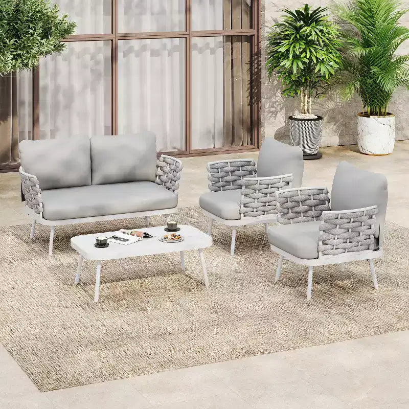 Ensemble de salon de jardin moderne 4 pièces Belle de Christopher Knight Home, en métal et corde rembourrée, avec table basse