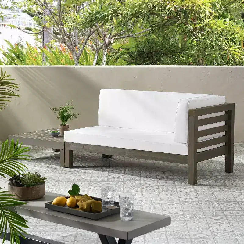 Christopher Knight Home Oana conjunto de sofá biplaza con brazo derecho para exteriores, de madera de acacia, y mesa de centro, con cojín