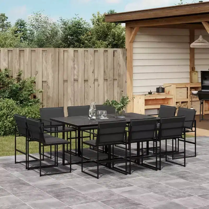 Conjunto de comedor para patio de 11 piezas de vidaXL con cojines, textileno negro