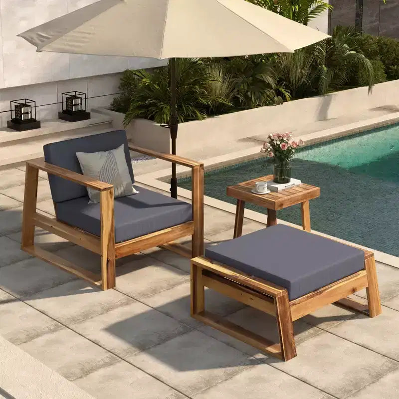 GDFStudio Camille conjunto de silla de descanso y otomana para exteriores de madera de acacia con cojines