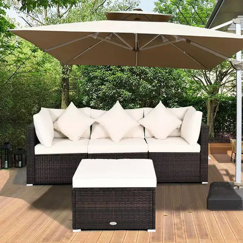 Ensemble de mobilier de patio Costway 4 pièces en résine tressée imitation rotin, avec canapé, coussins et ottoman