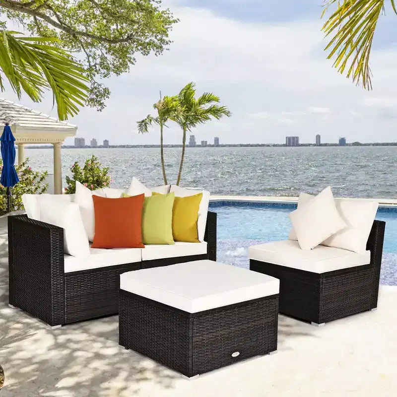 Ensemble de mobilier de patio Costway 4 pièces en résine tressée imitation rotin, avec canapé, coussins et ottoman