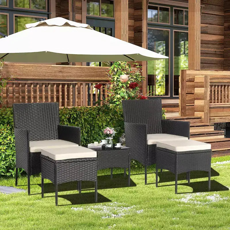 Ensemble de mobilier de jardin en rotin 5 pièces Costway, canapé rembourré, repose-pieds, accoudoirs et table d’appoint