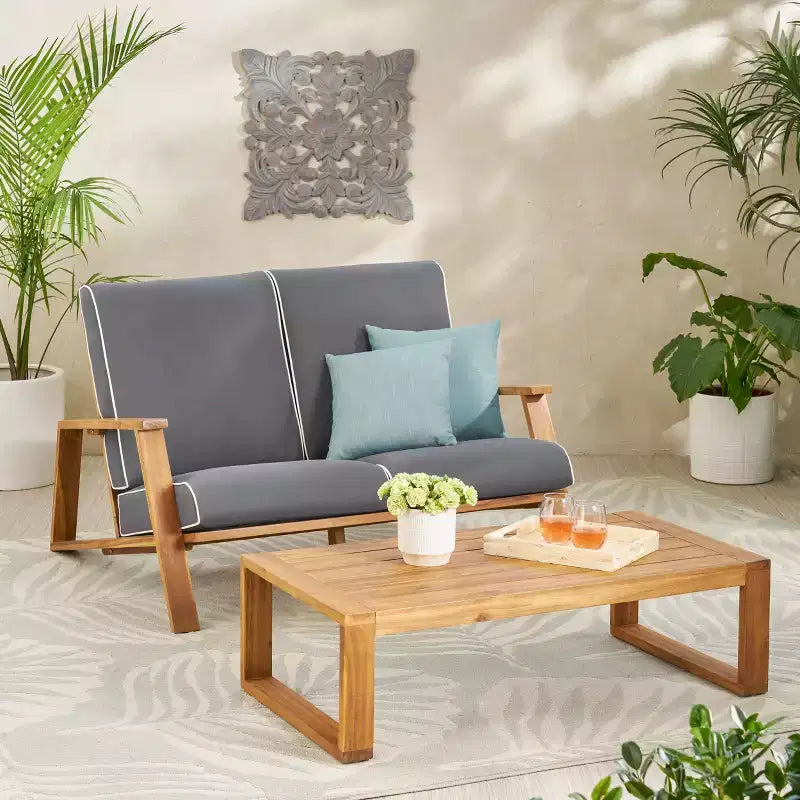 Ensemble causeuse et table d’extérieur Paloma de Christopher Knight Home en bois d’acacia avec coussins